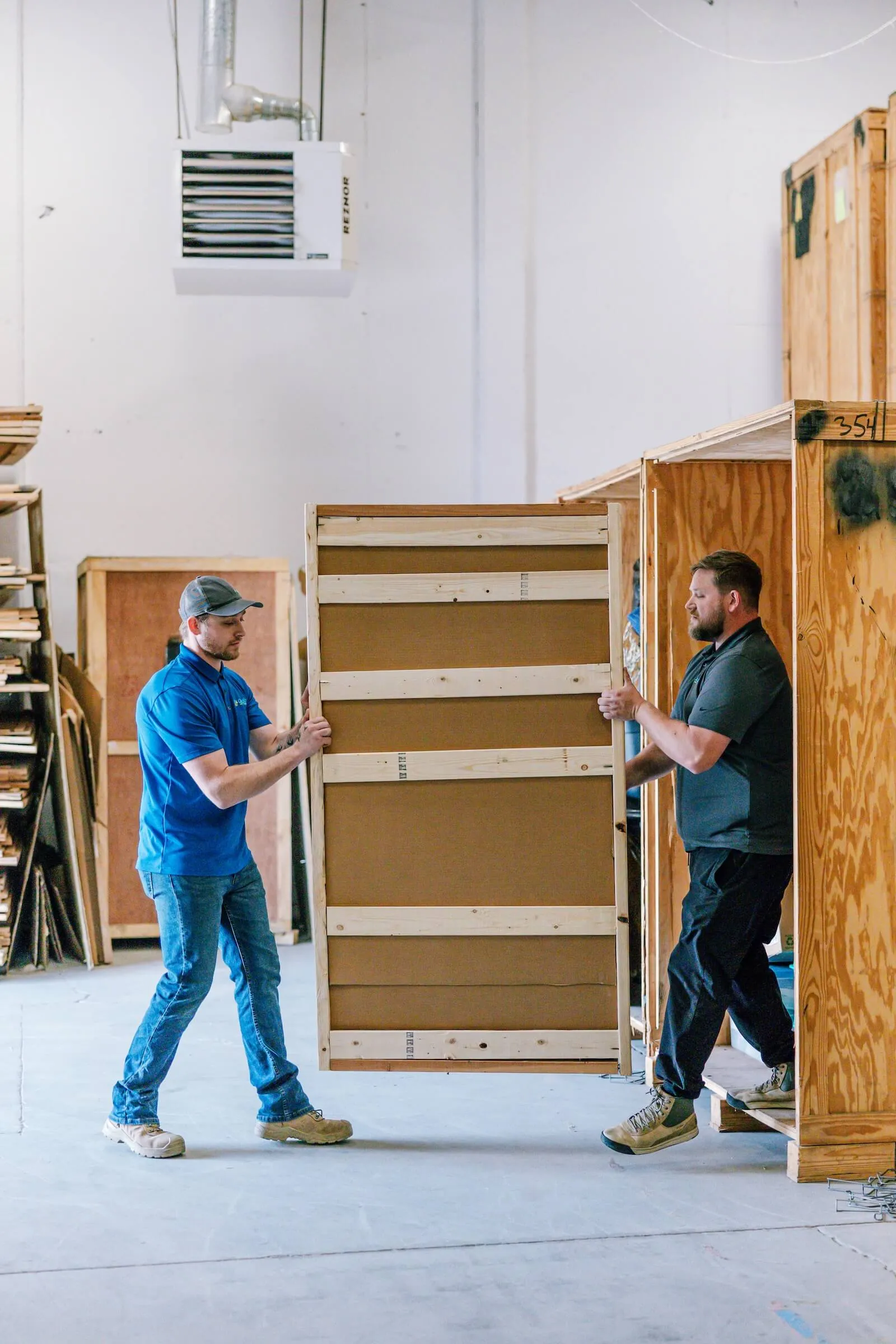 Professional movers preparing boxes