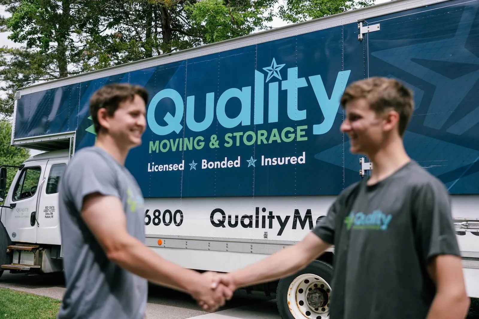 Moving crew assisting a customer with care